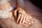 Close-up hands with a neat french manicure. Rings on the fingers. Gentle fresh morning hands