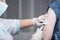 Close-up hands,nurses are vaccinations to patients using the syringe.Doctor vaccinating women in hospital.Are treated by the use