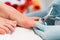 Close-up of the hands of a pedicurist wearing surgical gloves