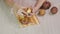 Close-up hands peel potatoes with a knife. The process of preparing vegetables for cooking