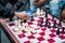 Close up of hands of people playing quick chess on the street with timer