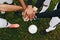 Close up of hands of players standing together in a huddle