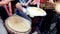 Close up. Hands playing on a djembe african drum, musical instrument. Street