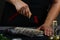 Close-up Hands in the process cooking fish with lemon juice. carp fish with various ingredients lemon, herbs and spices on shale b