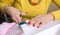 Close-up of the hands of a seamstress with scissors