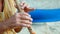 Close-up hands of senior man playing bamboo flute