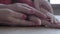 Close up of hands of senior mature woman and little girl. Grandmother spends time with granddaughter, they hold hands