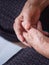 Close-up of hands senior woman joined together for meditation. Concept of aged people and religion