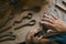 Close up of hands shaping ceramic