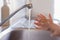 Close up hands of a small children washing hands with soap and water. Clean and hygiene concept