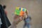 Close-up of hands solving a Rubik`s Cube. Color puzzle.