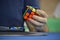 Close-up of hands solving a Rubik`s Cube. Color puzzle.