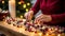 Close up of hands stringing popcorn and cranberries to create a homemade garland