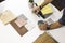 Close up of hands on the table during an office presentation with three young architects displaying some materials for an interior