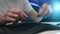 Close-up hands of unrecognizable repairman assembling disassembled keyboard after cleaning of dirt and dust. PC male