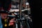 Close-up hands of unrecognizable repairman repairing mountain bike using special tool working in bicycle repair shop