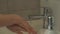 Close-up hands of unrecognizable woman washing hands with liquid soap sanitizer gel, rinsing with hot water over