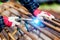 Close up of the hands welder worker with electrode