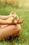 Close up hands. Woman do yoga outdoor. Woman exercising vital and meditation for fitness lifestyle club at the outdoors nature bac