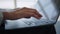 Close-up hands of woman working on laptop in airport hall background of plane in window waiting for boarding. Concept