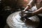 Close-up of hands working clay on potter\'s wheel. Work in the studio potter