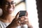 Close up hands of young black woman holding smartphone