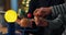 Close-up of the hands of a young boy assembling a solar system. The child is putting a planet on the model