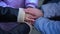 Close-up handstack of teenage classmates outdoors on schoolyard. Unrecognizable group of boys and girls stacking hands