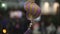 Close up of hanging and rotating toy for decoration. Clip. Beautiful Chinese purple and golden small new year toy