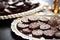 close-up of hanukkah gelt chocolate coins on a silver plate