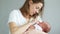 Close-up of happiness mother holding newborn baby on her arms. Happy motherhood, mother and child, sleeping baby