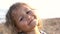 Close-up happy child face. Children in summer nature view at the beach, 4k