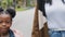 Close up happy child walk with mom in park daughter and mother smiling happily looking at camera african american family