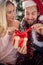 Close up of a happy couple sharing gifts on Chrismas morning