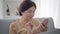 Close-up of happy elegant Caucasian woman using smartphone. Portrait of smiling middle-aged brunette woman with brown