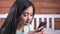 Close-up happy face of young Asian woman flirting writing message using smartphone