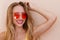 Close Up Of Happy Girl in pink sunglasses isolated. Summer holidays and fun time weekend. Summertime concept. Smiling young woman