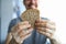 Close up happy guy holds piece whole grain bread
