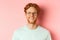 Close up of happy redhead man face, smiling with white teeth at camera, wearing glasses for better sight and t-shirt