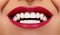 Close-up Happy Smile with Healthy White Teeth, Bright Red Lips Make-up. Cosmetology, Dentistry and Beauty care