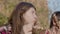 Close-up of happy teenage girl and preteen boy enjoying shashlik