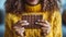 Close up of a happy young African American woman holding a chocolate bar in her hands
