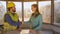 CLOSE UP: Happy young woman and contractor shake hands on a sunny morning.