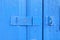 Close up Hasp Lock on Blue Wood Door.