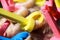 Close up of head of european woman with blonde hair and colorful old-fashioned foam curlers