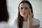 Close up head shot unhappy young woman checking skin