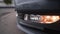 Close-up of headlights of modern car model. Action. Daytime running lights of new car. Beautiful front lights of new car