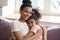 Close up headshot portrait of african american mother and daughter.