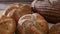 Close up of healthy bakery products, organic buns, bagels and rye bread