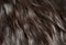 Close up healthy hair texture, dark brown wavy natural hair, con